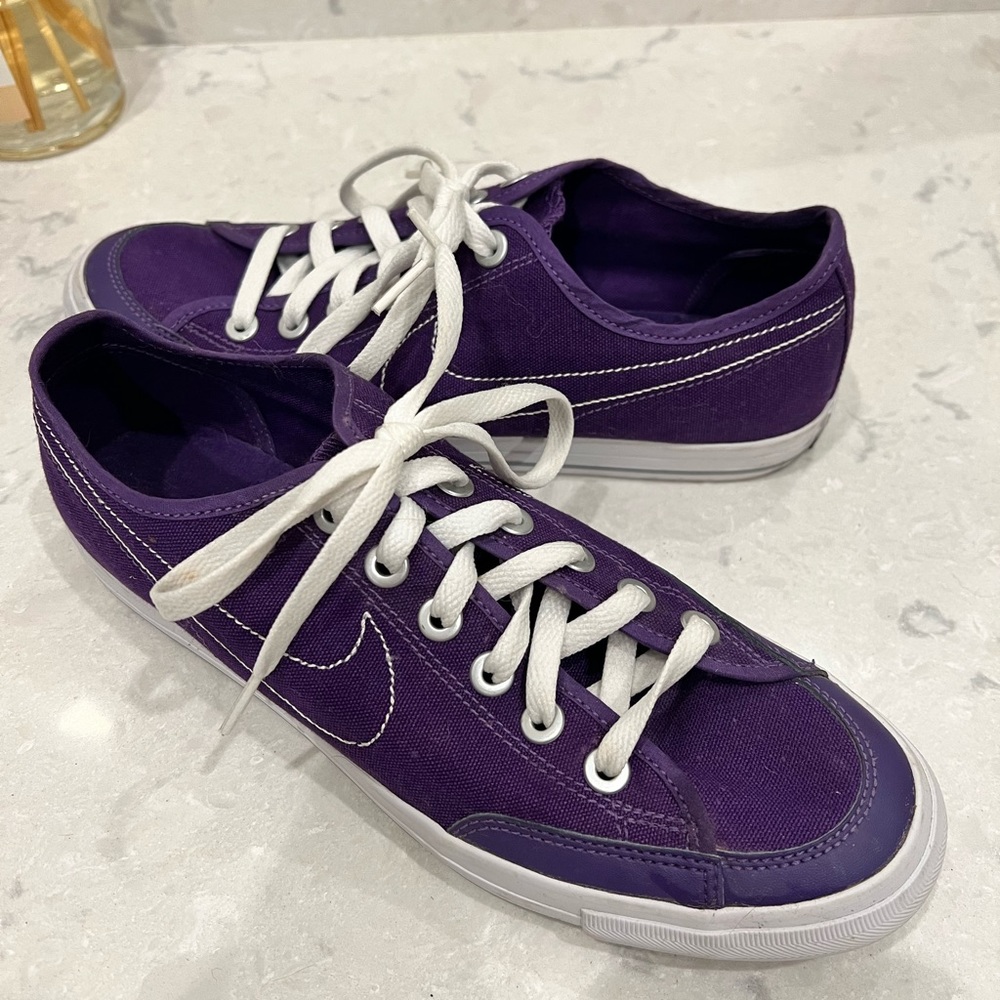 Women’s Purple Nike Canvas low sneakers.